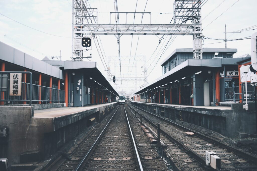 a train station with a train on the tracks