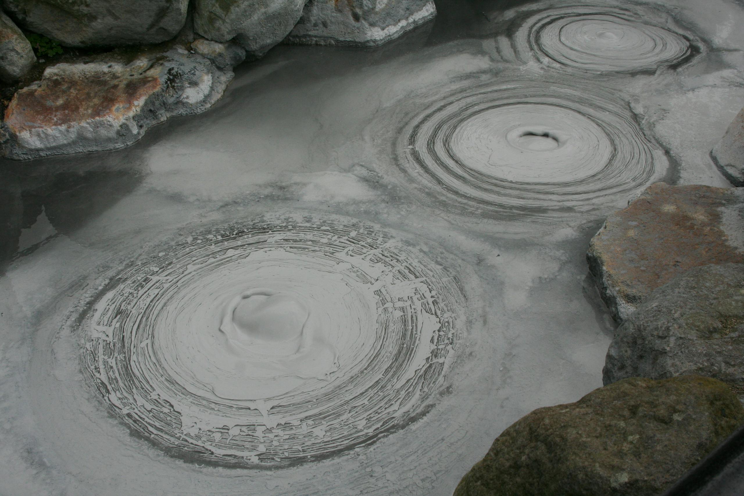 Captivating image of bubbling mud pools in Beppu, a renowned geothermal area in Japan.