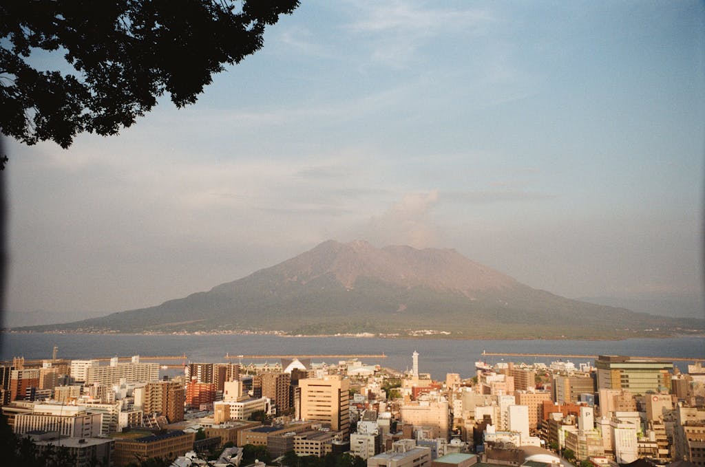 Dramatic view of Kagoshima cityscape with Sakurajima volcano in Japan.